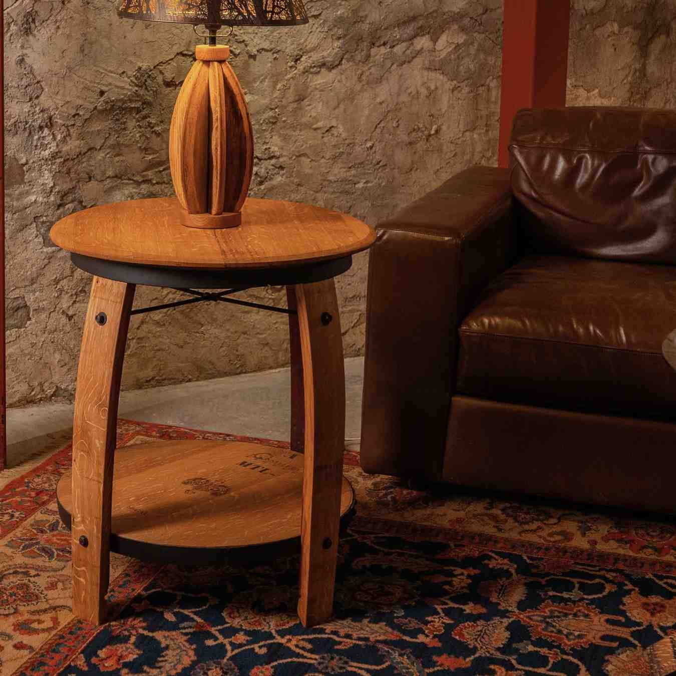Casq Wine Barrel End Table in a living room setting, featuring a round reclaimed barrelhead top, lower shelf, and curved oak staves as legs.