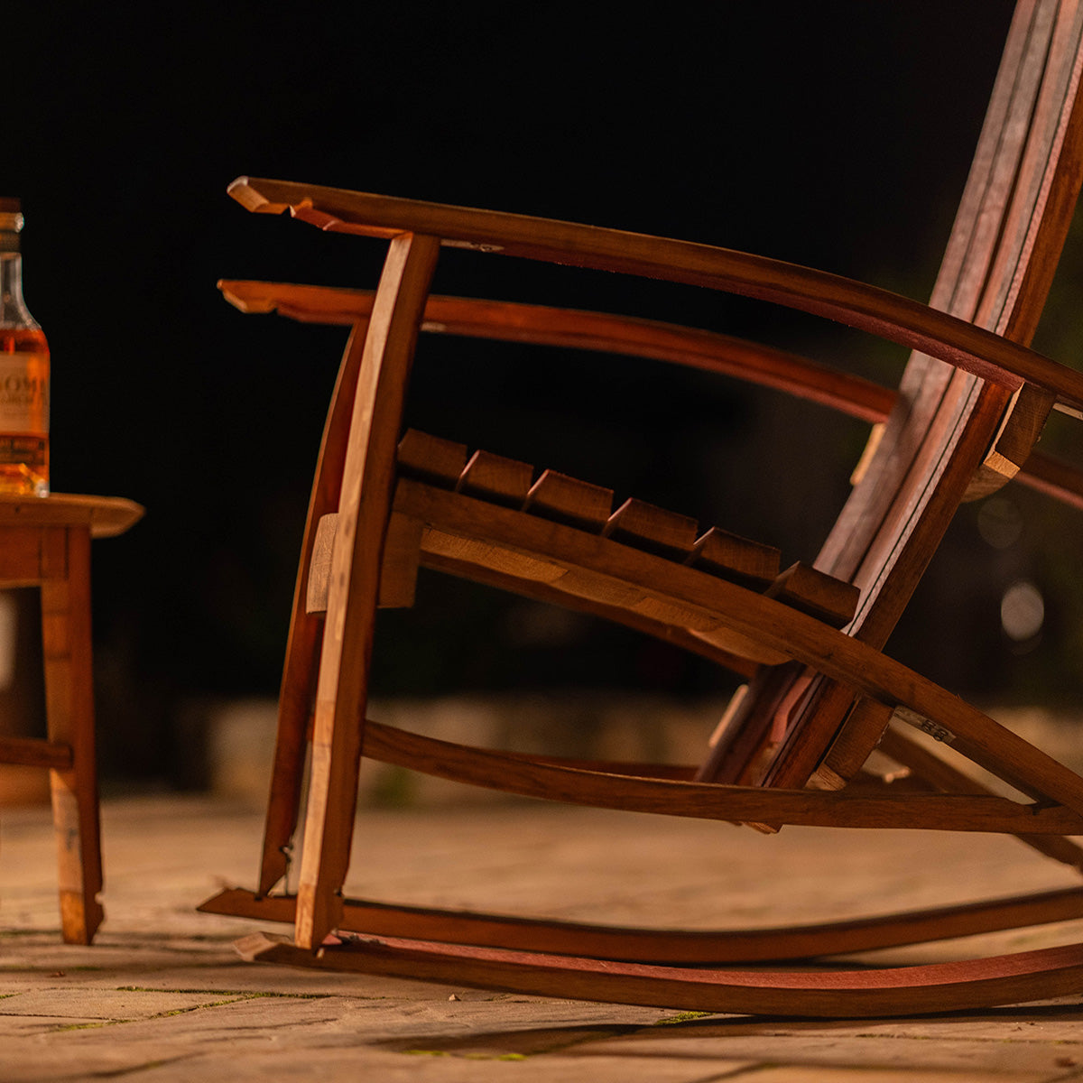 Reclaimed wood rocking chair for patio seating.