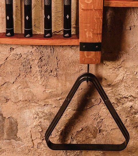 Traditional cooperage tool detail mounted on wood wall.
