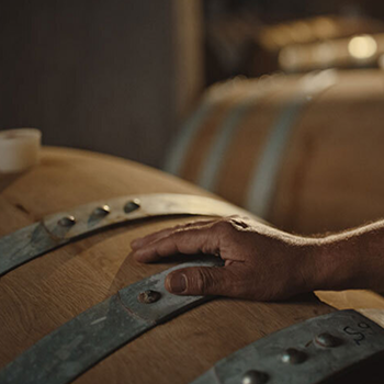 Whiskey barrel cleaning process before reclaiming oak for handcrafted furniture and rustic lighting.