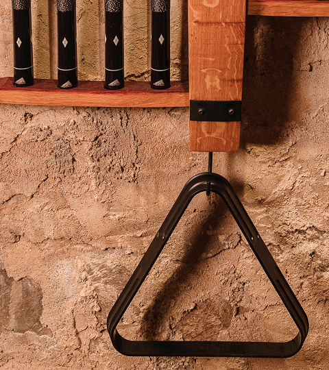 Traditional cooperage tool detail mounted on wood wall.