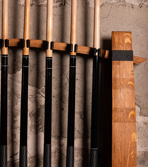 Reclaimed wood furniture detail with pipe legs and rustic metal hardware.