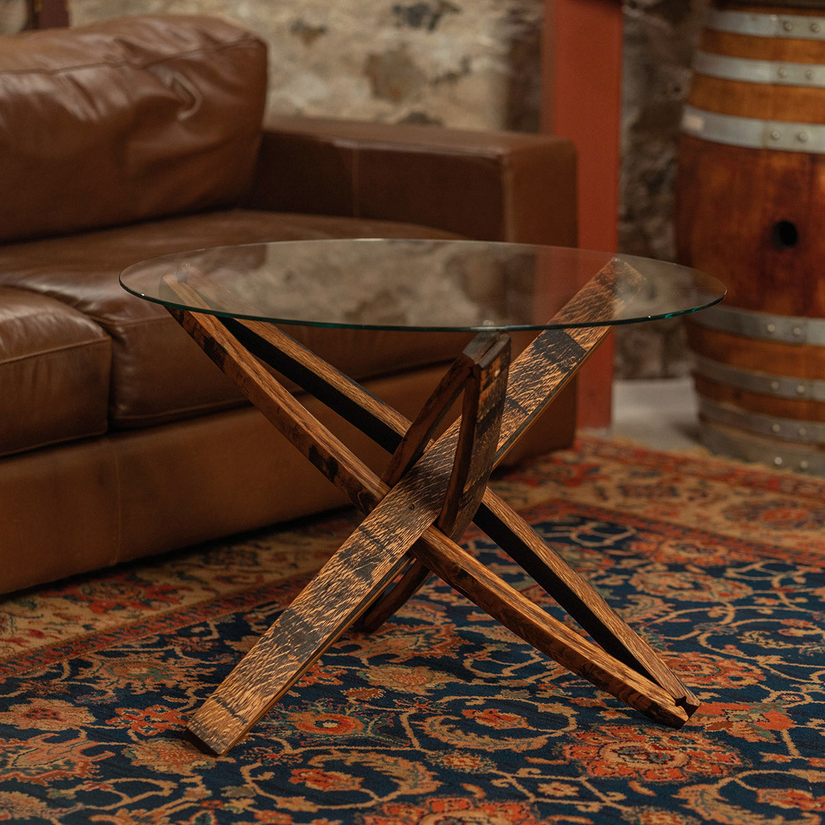 Full view of the Stavv™ Whiskey Barrel Coffee Table with a tempered glass top and handcrafted stave base.