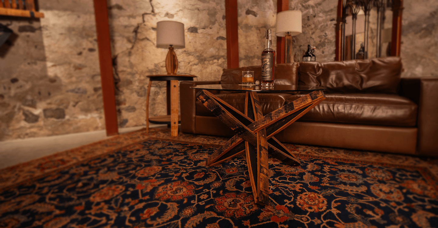 Reclaimed Wood Table built from whiskey barrel staves, in home bar full of reclaimed furniture.